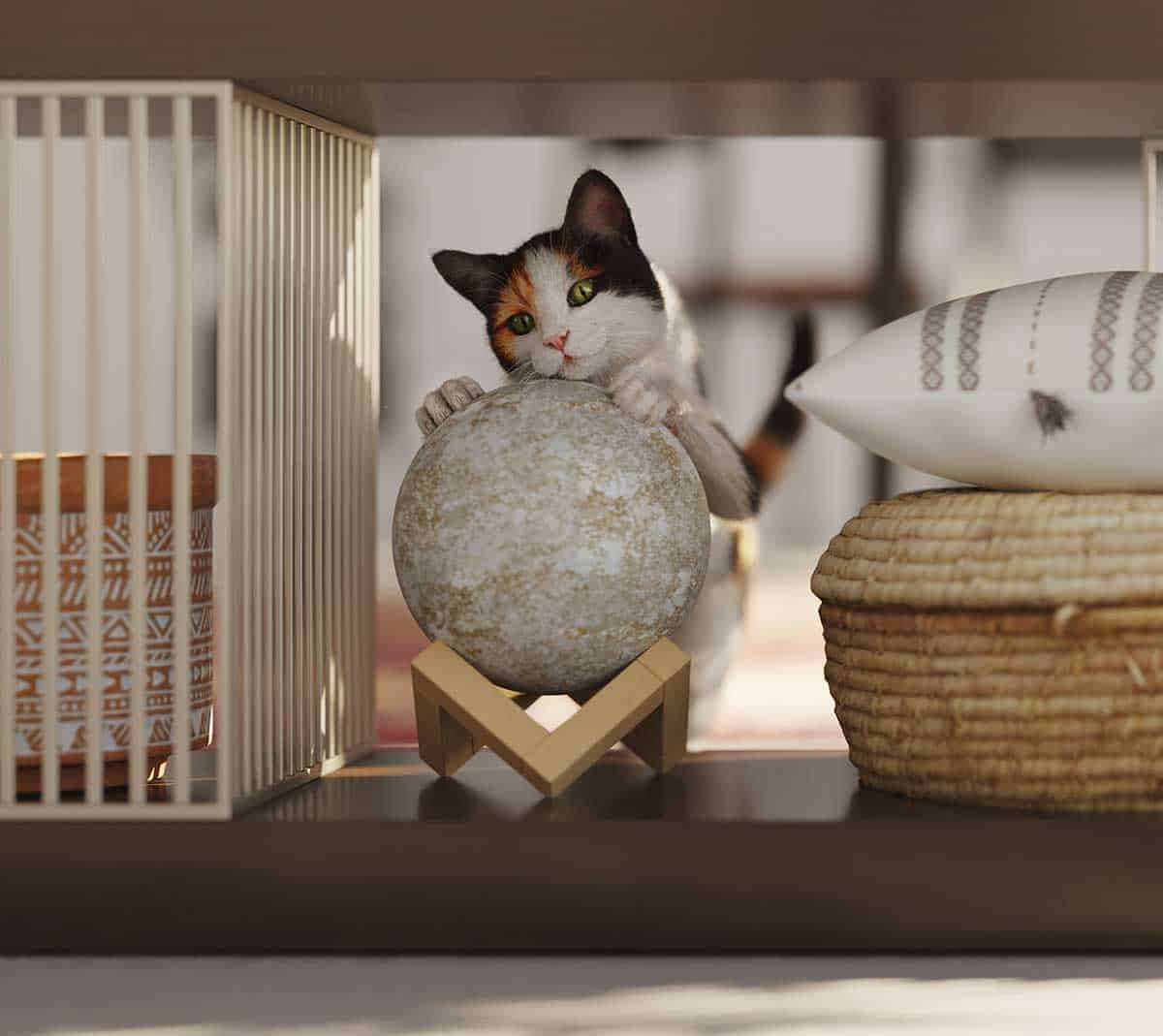 A cat playing with a knicknack
